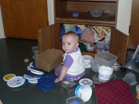 Aug 27/07 - Isabel organizing the cupboard