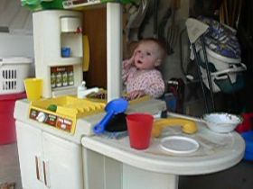 Apr 17/08 - Isabel playing in her kitchen