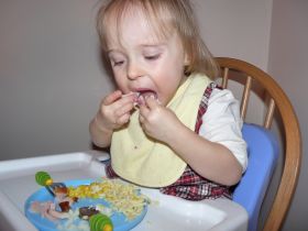 Dec 26/08 - Isabel eating Christmas dinner