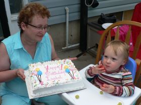 July 13/08 - Grandma presents Isabel with her birthday cake